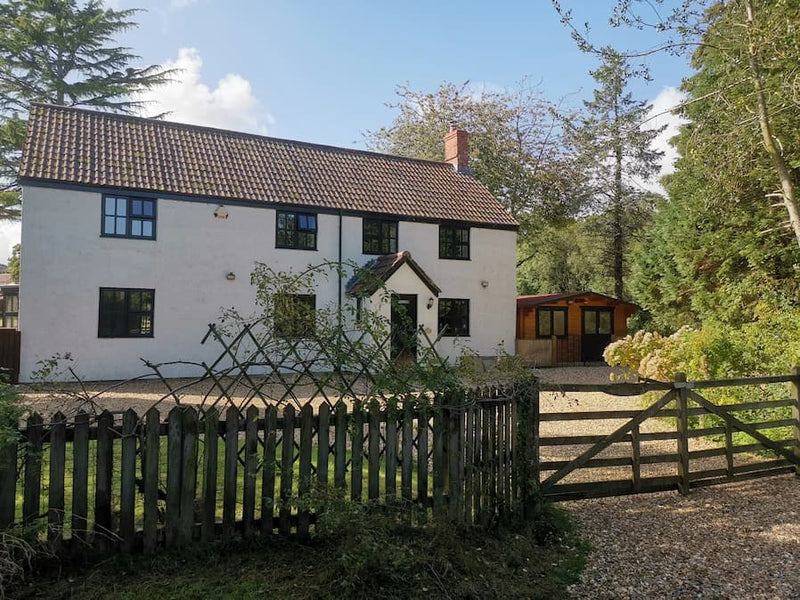 white cottage in countryside setting